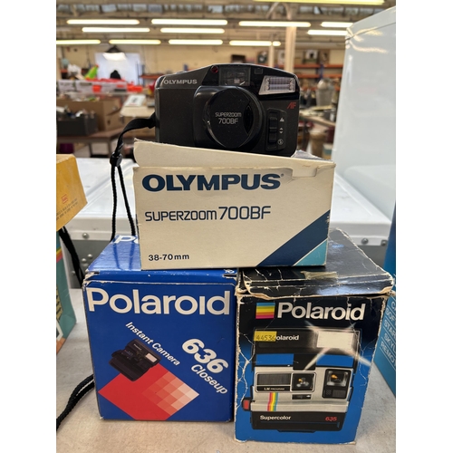 728 - A collection of boxed cameras to include Olympus Superzoom 700BF, Pentax Espio 145M Super, Polaroid ... 