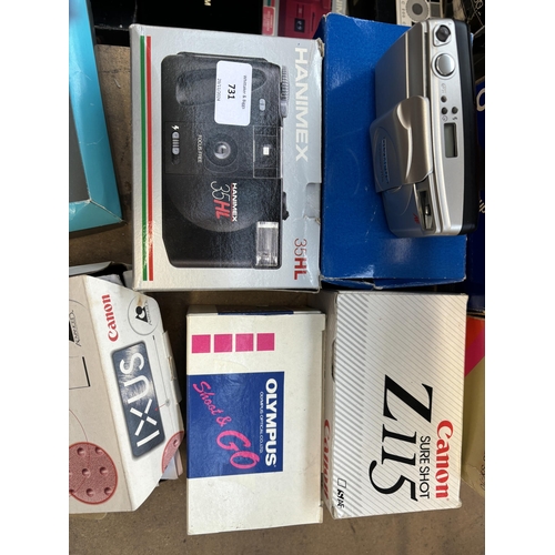 731 - A collection of boxed cameras to include Olympus Superzoom 70G, Canon Sureshot Z115, Olympus Shoot &... 