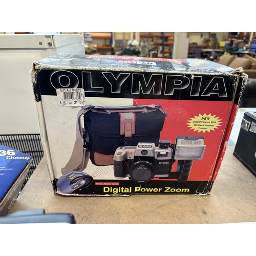 731 - A collection of boxed cameras to include Olympus Superzoom 70G, Canon Sureshot Z115, Olympus Shoot &... 