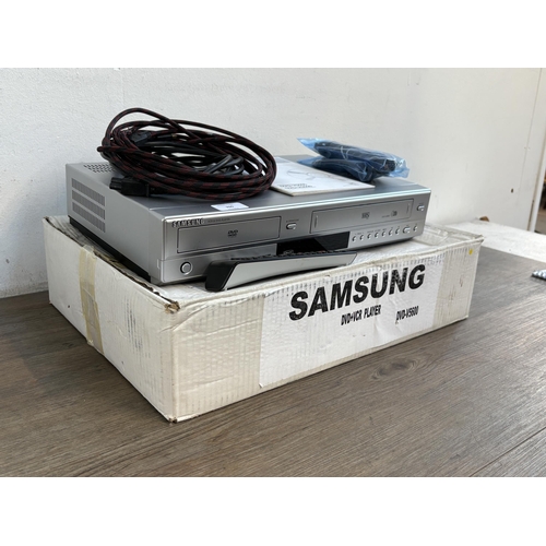 760 - A boxed Samsung DVD-V5600 VCR/DVD player combo with remote control, cables and instruction manual