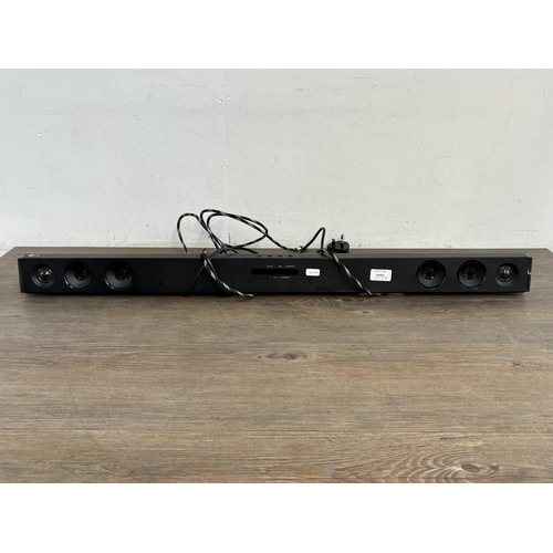 765A - An LG SK1D sound bar with remote control