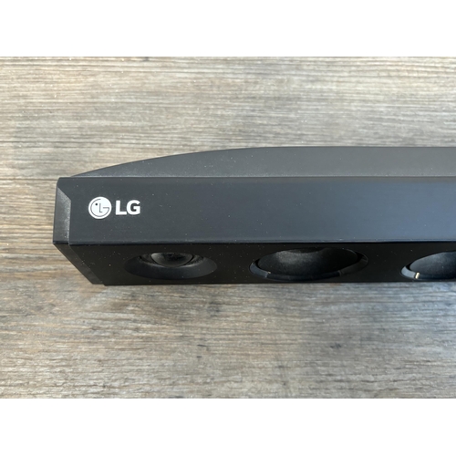 765A - An LG SK1D sound bar with remote control