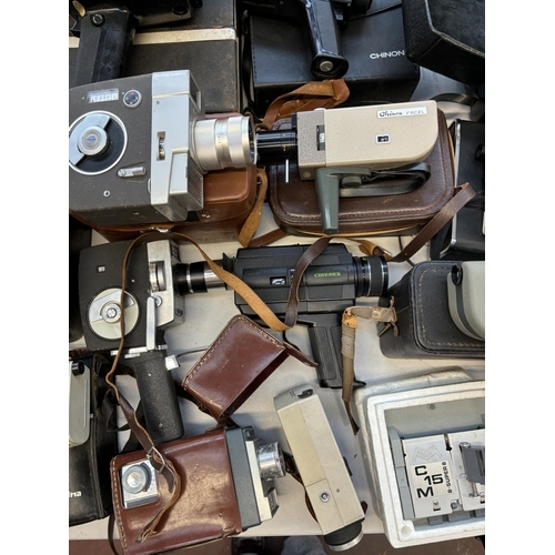 745 - A collection of cine cameras to include Chinon, Sankyo, Halina, Eumig, Bell & Howell etc.