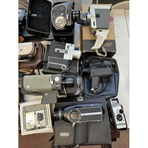 745 - A collection of cine cameras to include Chinon, Sankyo, Halina, Eumig, Bell & Howell etc.