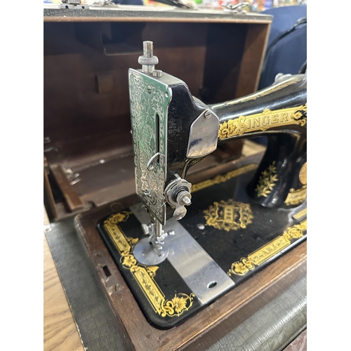 823 - A cased 1939 Singer 28K hand-crank sewing machine