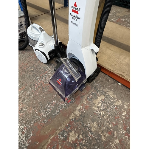 833 - Five cleaners, one VAX MachAir Revive upright bagless vacuum, one Hoover Blaze upright bagless vacuu... 