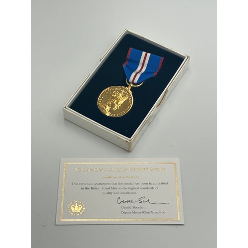 2285 - A boxed Elizabeth II The Queen's Golden Jubilee medal with certificate of authenticity