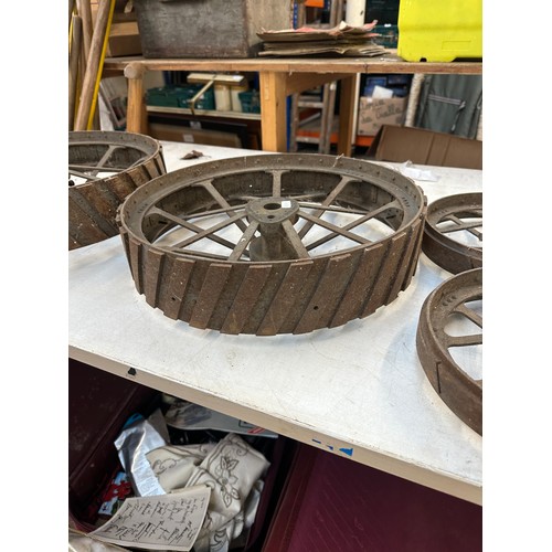 1059B - Four cast iron traction engine wheels to include two Charles Burrell & Sons etc.