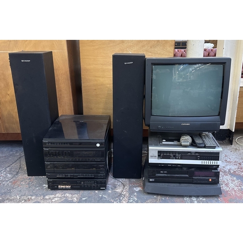 802 - Four items with remote controls, one Sharp hi-fi system comprising two-speed turntable, three-band r... 