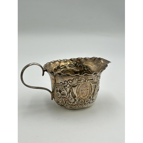 2282 - A Victorian hallmarked London silver repousse milk jug, dated 1895 - approx. gross weight 50.6g