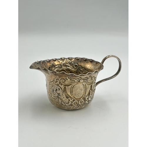 2282 - A Victorian hallmarked London silver repousse milk jug, dated 1895 - approx. gross weight 50.6g