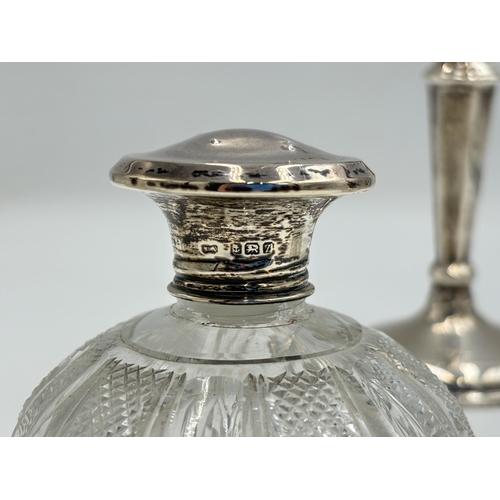 2283 - Four hallmarked sterling silver items, one weighted candlestick - approx. gross weight 195g, one cut... 