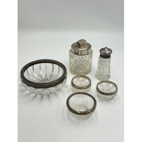 2284 - Six pieces of glassware with hallmarked sterling silver tops