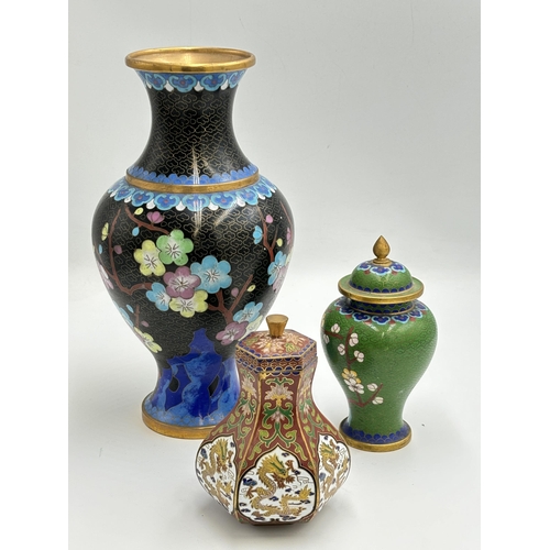 2291 - Three Chinese cloisonné items, one 23cm vase with stand and two jars and covers