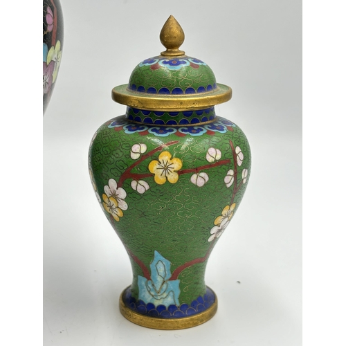 2291 - Three Chinese cloisonné items, one 23cm vase with stand and two jars and covers