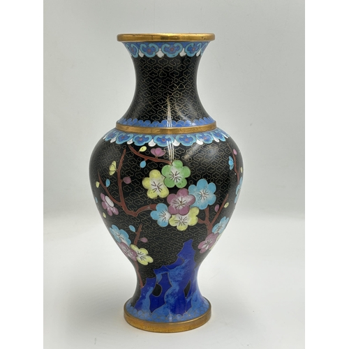 2291 - Three Chinese cloisonné items, one 23cm vase with stand and two jars and covers