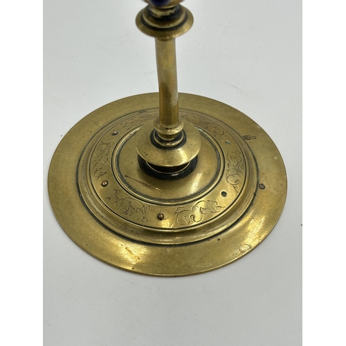 2292 - An Arts & Crafts etched brass candlestick with inset blue cabochon stone - approx. 20cm high