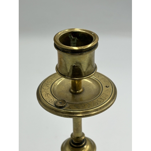 2292 - An Arts & Crafts etched brass candlestick with inset blue cabochon stone - approx. 20cm high