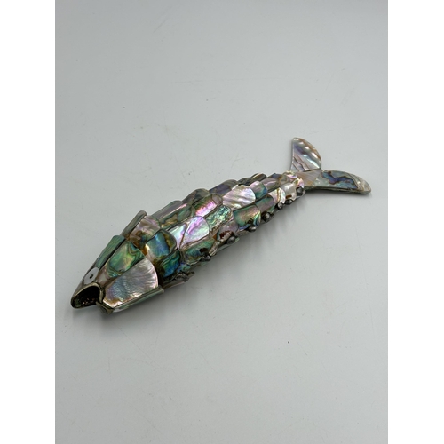 2296 - A vintage abalone shell articulated fish bottle opener - approx. 18cm long