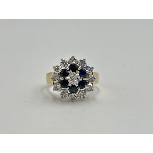 2133A - A hallmarked 9ct gold diamond and sapphire ring, size N - approx. gross weight 4.35g