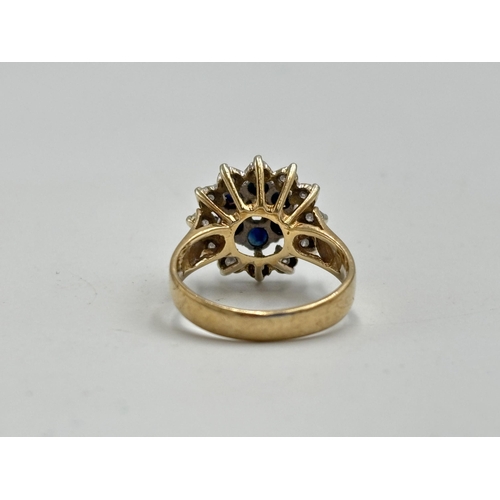 2133A - A hallmarked 9ct gold diamond and sapphire ring, size N - approx. gross weight 4.35g