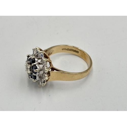 2133A - A hallmarked 9ct gold diamond and sapphire ring, size N - approx. gross weight 4.35g