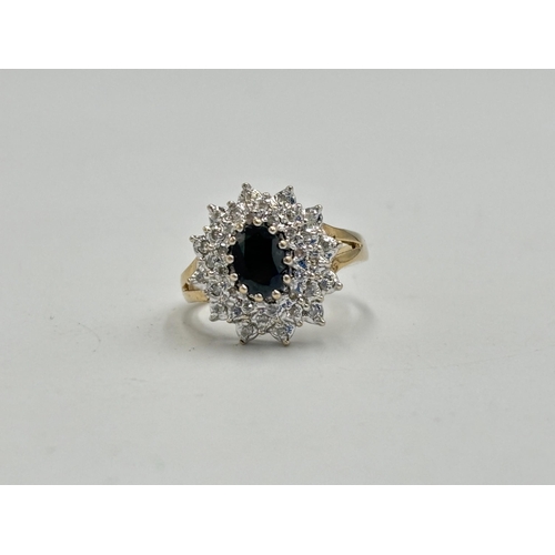 2133B - A hallmarked 9ct gold diamond and sapphire ring, size N½ - approx. gross weight 4.2g