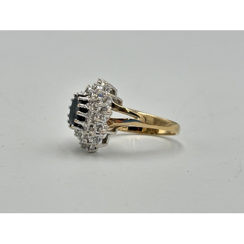 2133B - A hallmarked 9ct gold diamond and sapphire ring, size N½ - approx. gross weight 4.2g