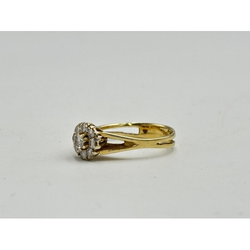 2133H - A hallmarked 14ct diamond daisy ring, size N½ - approx. gross weight 3.25g