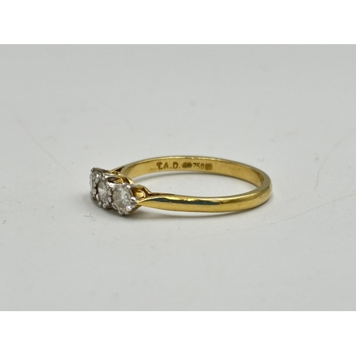 2133I - A hallmarked 18ct gold 0.5ct three stone diamond ring, size Q - approx. gross weight 2.7g