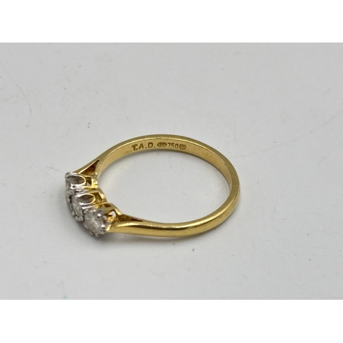 2133I - A hallmarked 18ct gold 0.5ct three stone diamond ring, size Q - approx. gross weight 2.7g