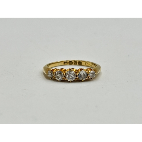 2133K - A hallmarked 18ct gold five stone diamond ring, size K - approx. gross weight 2.65g