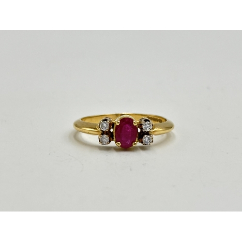 2133M - A hallmarked 18ct gold diamond and ruby ring, size O - approx. gross weight 3.35g