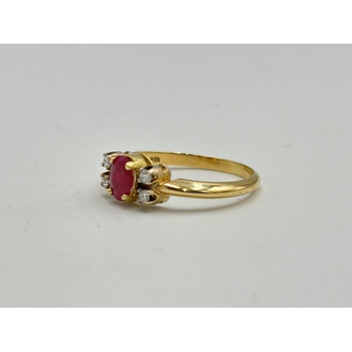 2133M - A hallmarked 18ct gold diamond and ruby ring, size O - approx. gross weight 3.35g