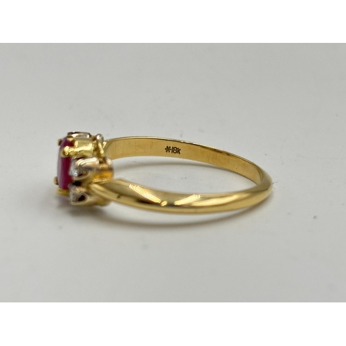 2133M - A hallmarked 18ct gold diamond and ruby ring, size O - approx. gross weight 3.35g