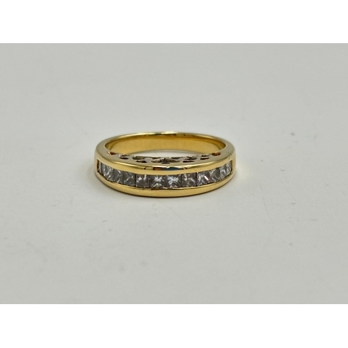 2133N - A hallmarked 18ct gold diamond channel set ring, size N - approx. gross weight 5.85g