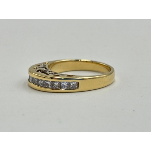 2133N - A hallmarked 18ct gold diamond channel set ring, size N - approx. gross weight 5.85g