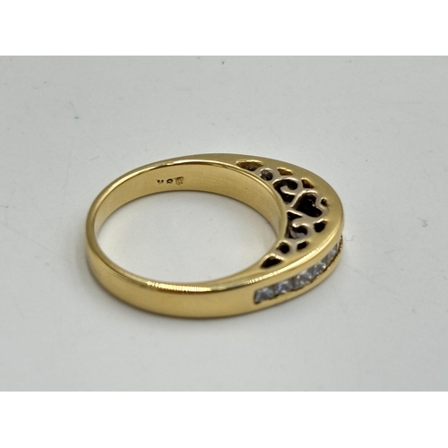 2133N - A hallmarked 18ct gold diamond channel set ring, size N - approx. gross weight 5.85g