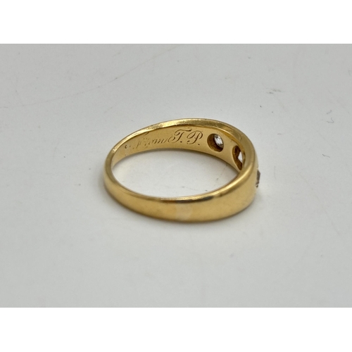 2133O - A Victorian 18ct gold three stone diamond ring, dated 1887, size L½ - approx. gross weight 3.75g