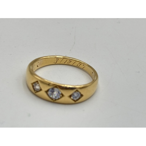 2133O - A Victorian 18ct gold three stone diamond ring, dated 1887, size L½ - approx. gross weight 3.75g