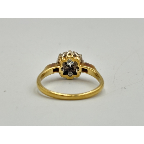 2133U - A hallmarked 18ct gold diamond daisy ring, size O - approx. gross weight 3.25g