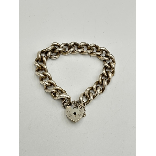 2134G - A silver padlock bracelet - approx. gross weight 54.2g