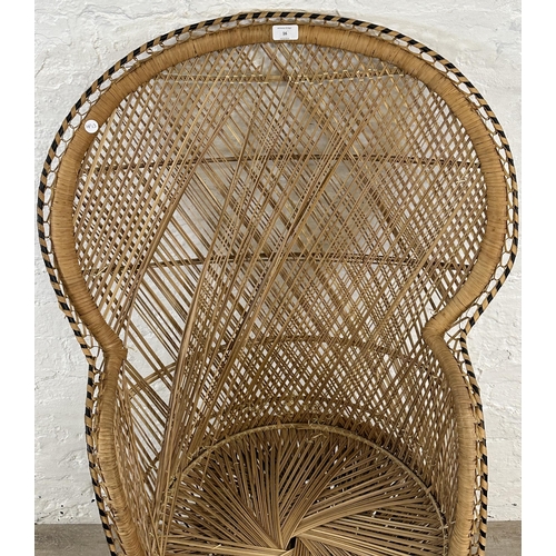 16 - A mid 20th century wicker peacock chair - approx. 114cm high x 70cm wide x 47cm deep