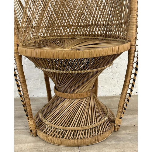 16 - A mid 20th century wicker peacock chair - approx. 114cm high x 70cm wide x 47cm deep