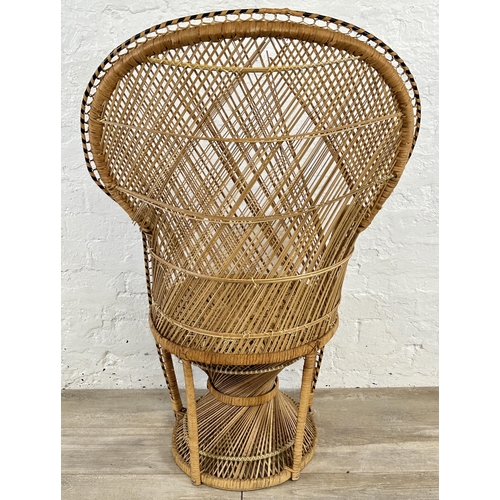 16 - A mid 20th century wicker peacock chair - approx. 114cm high x 70cm wide x 47cm deep