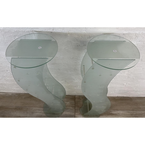 31 - A pair of contemporary glass CD racks - approx. 111cm high