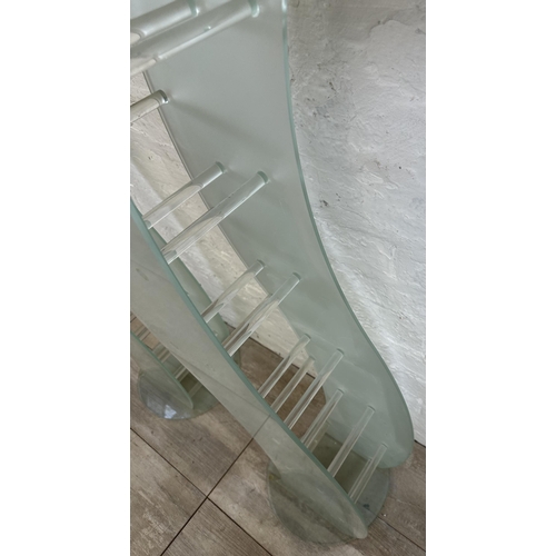 31 - A pair of contemporary glass CD racks - approx. 111cm high