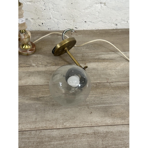 77 - Five pieces of lighting, two contemporary brass effect wall lights, two mid 20th century onyx table ... 