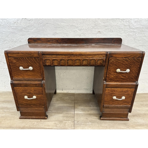 89 - An Art Deco carved oak dressing table - approx. 71cm high x 106cm wide x 46cm deep