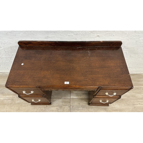 89 - An Art Deco carved oak dressing table - approx. 71cm high x 106cm wide x 46cm deep